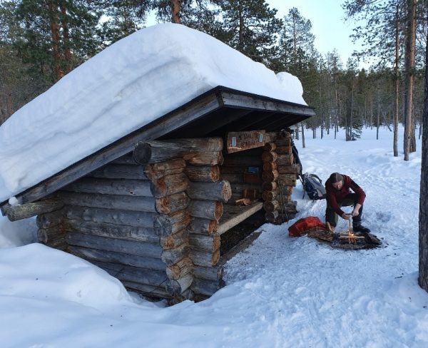 Finnish Lapland in Winter Hut with campfire